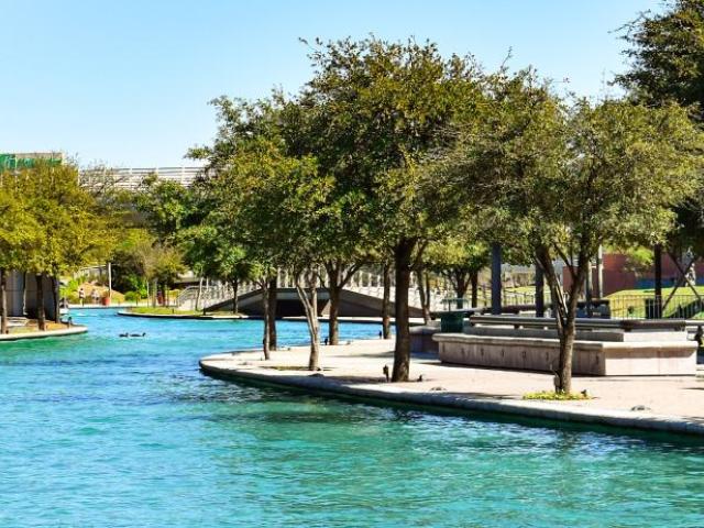 blue water canal in a city scape